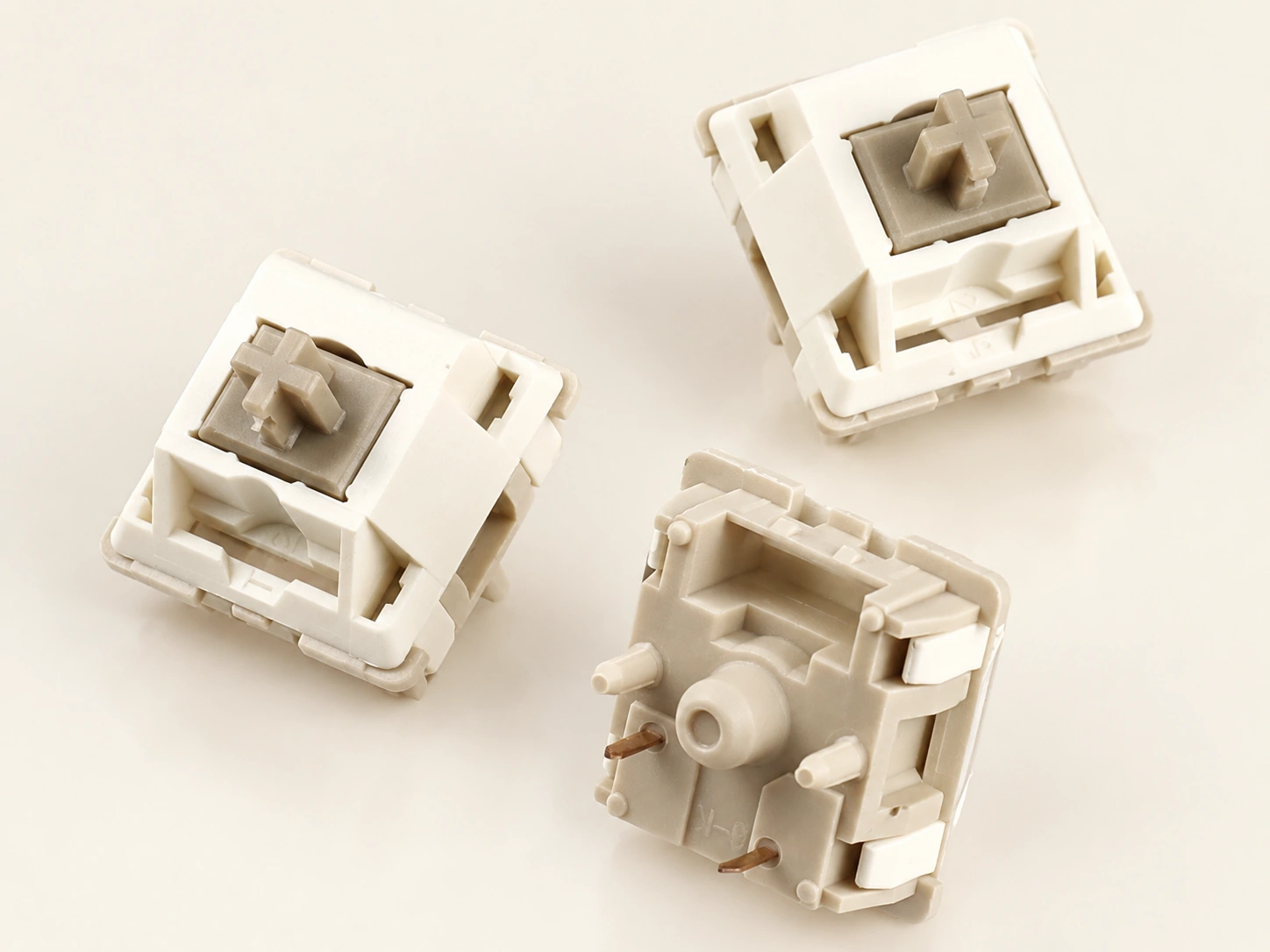 Xuhua Doll linear switches with a close view of the five-pin underside