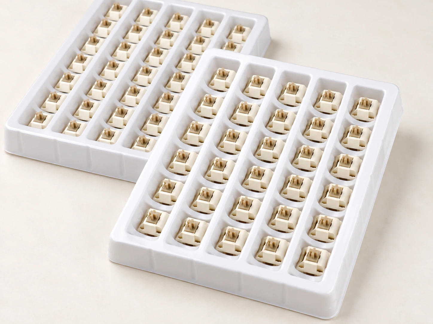 Xuhua Doll switches arranged in two white trays