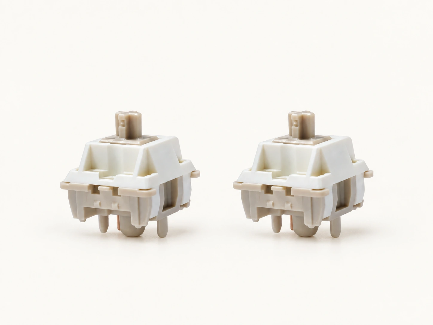 Two cream-colored Xuhua Doll linear switches with beige stems