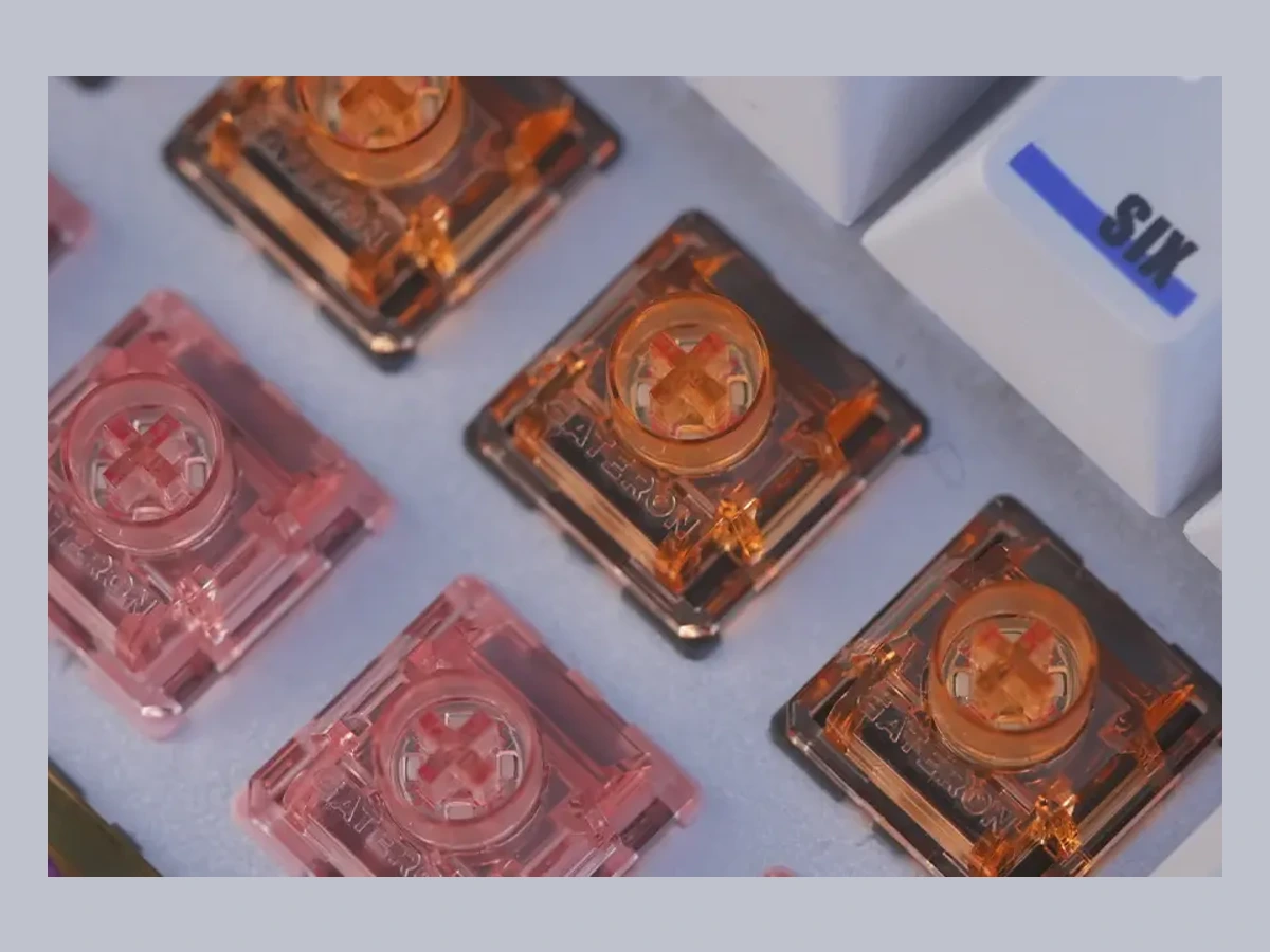 Gateron Magnetic Spark Orange and Pink switches in a manufacturer keyboard demonstration