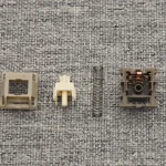 HMX Rain switch disassembled into housing, stem, spring and bottom housing