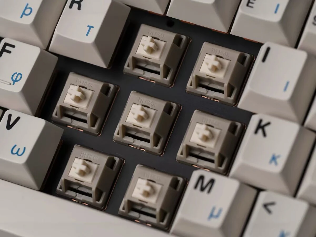 HMX Rain switches installed in a mechanical keyboard plate